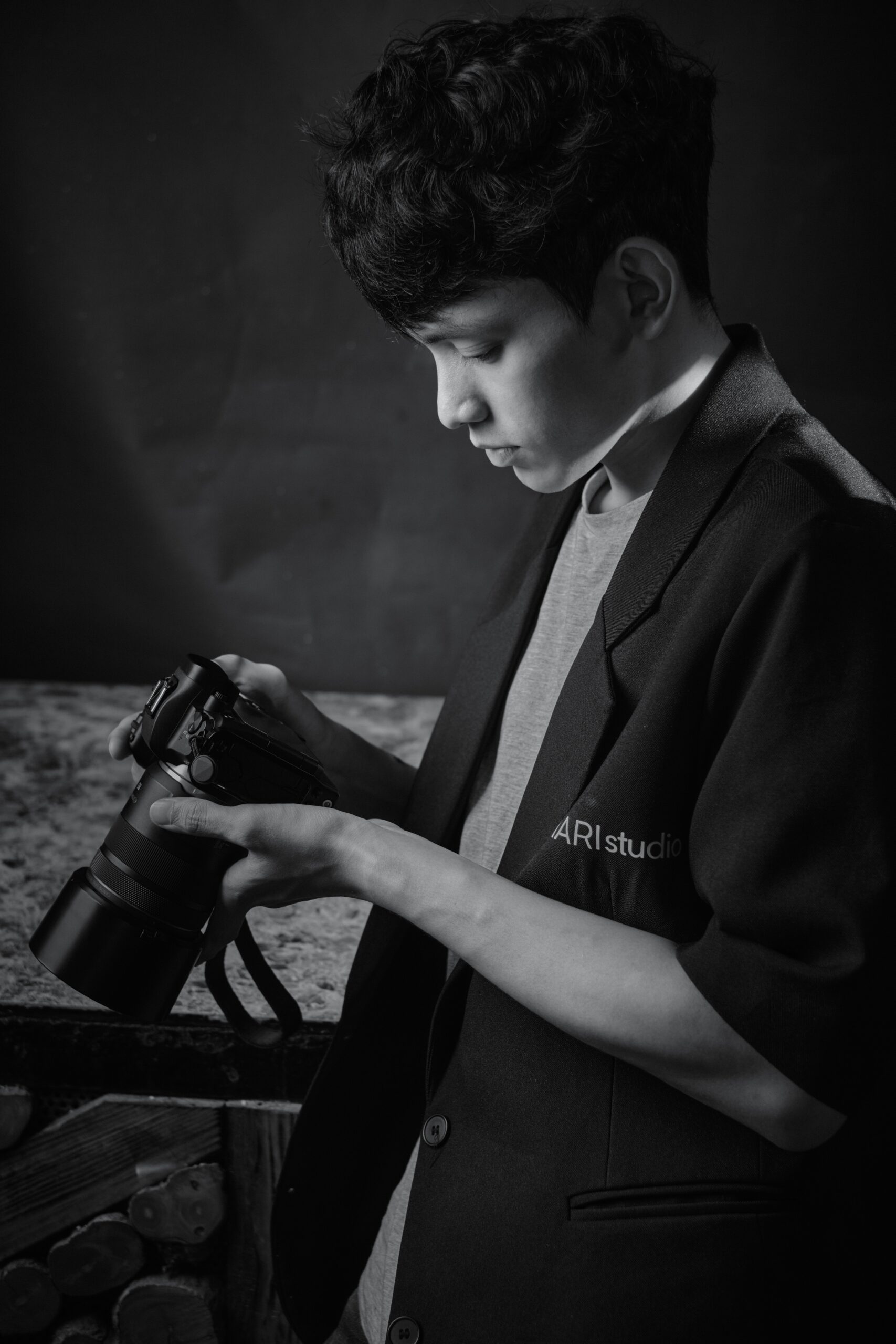 Photographer looking down at his camera