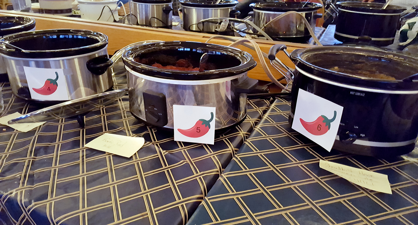 row of crock pots for chili cook-off contest