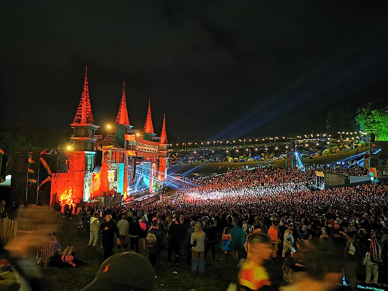 crowds gathered at night for a show, festival, lights