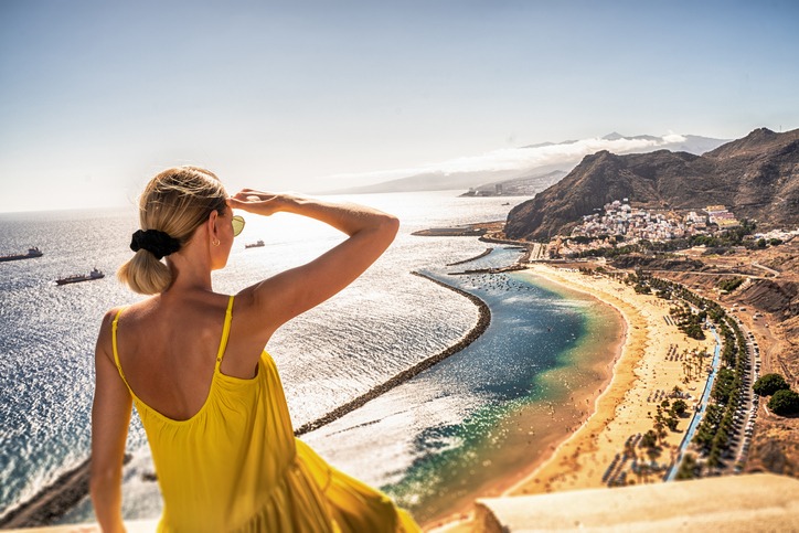 Amazing place to visit. Woman looking at the landscape of Las Teresitas beach and San Andres village, Tenerife, Canary Islands, Spain.