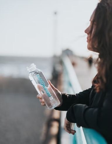 an image of a woman with a bottle of water