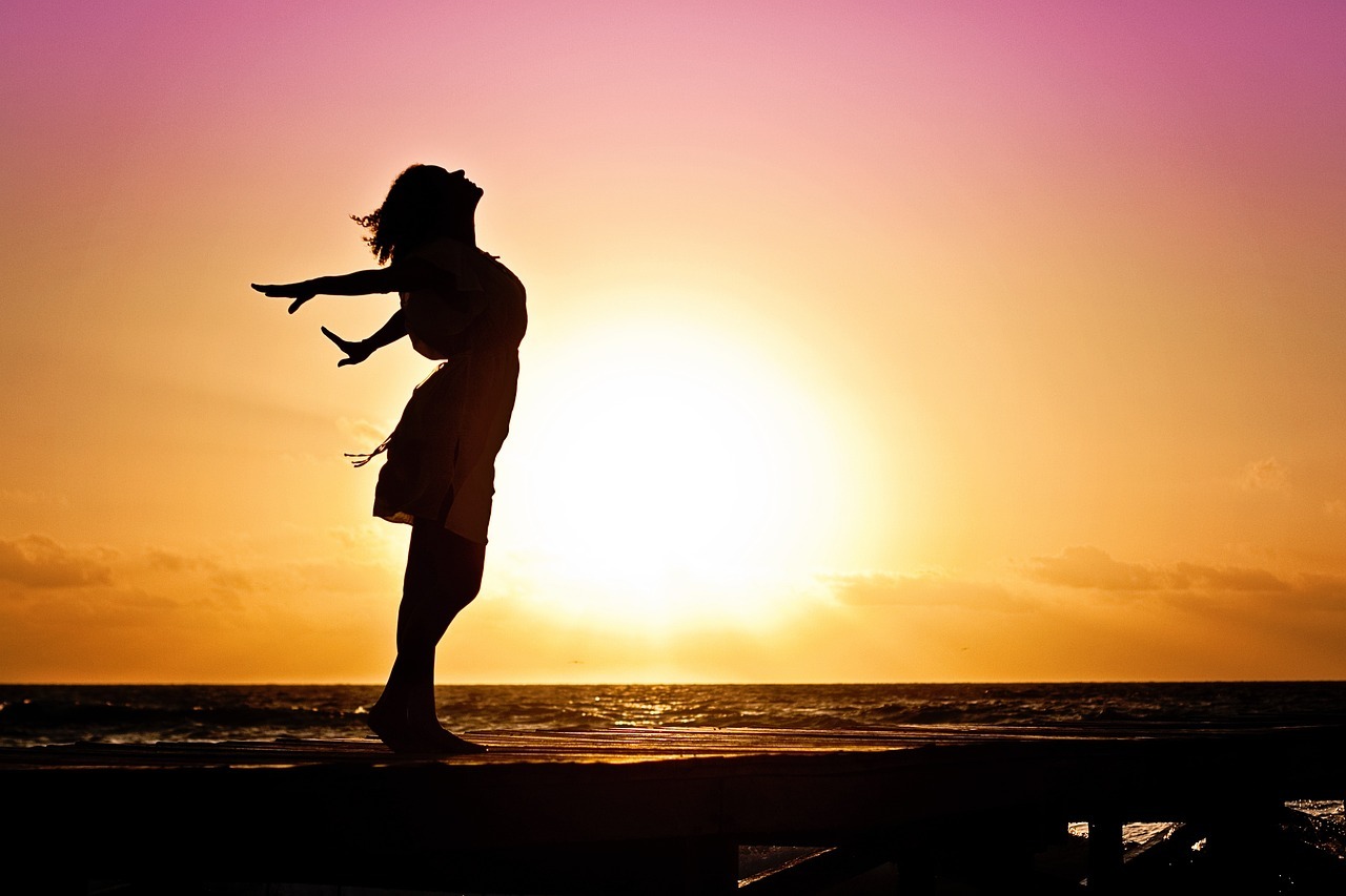 Woman silhouette sunset beach sea