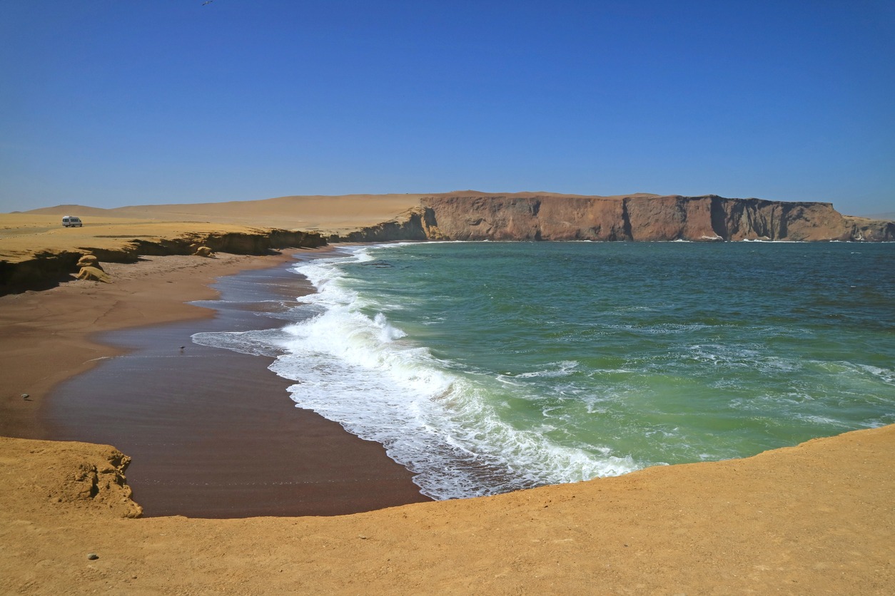red sand beach in Peru